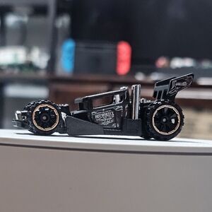 Black and Gold Toy Car with Decals
